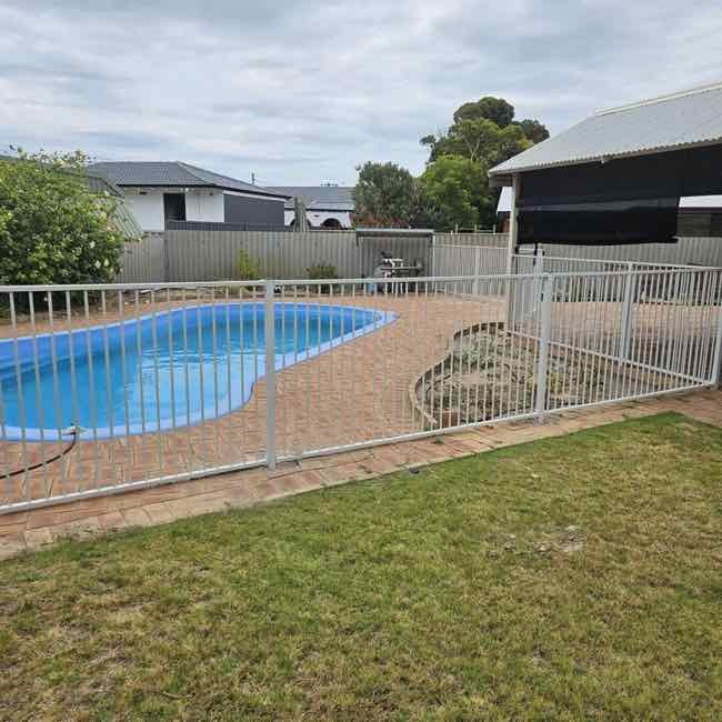 black tubular pool fence